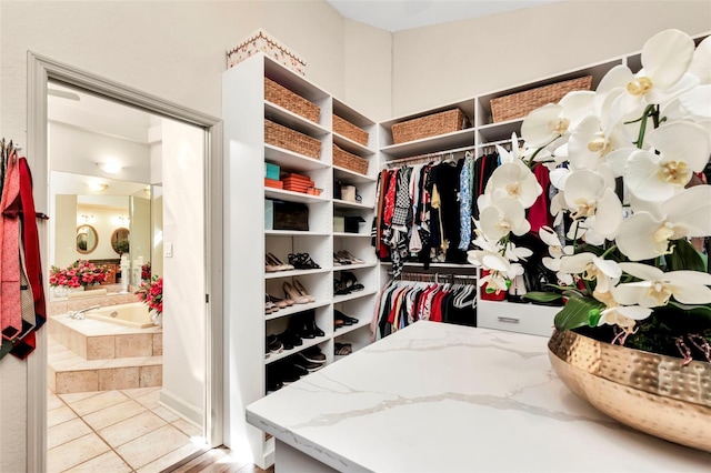 spacious closet with light tile patterned floors