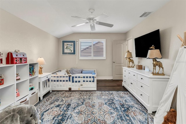 bedroom featuring ceiling fan, lofted ceiling, and dark hardwood / wood-style floors