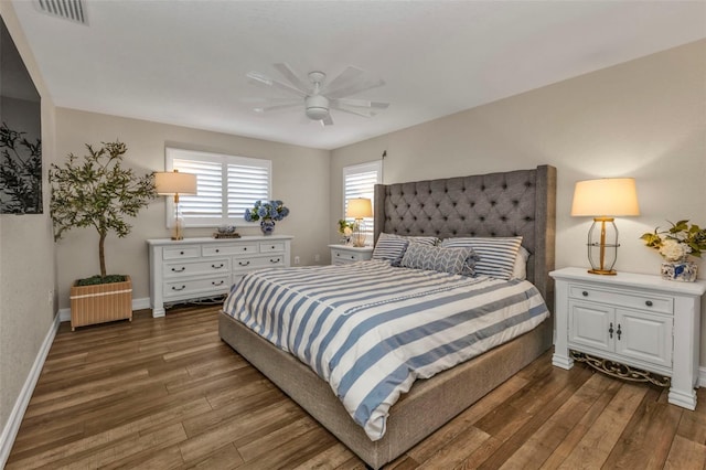 bedroom with ceiling fan and dark hardwood / wood-style flooring