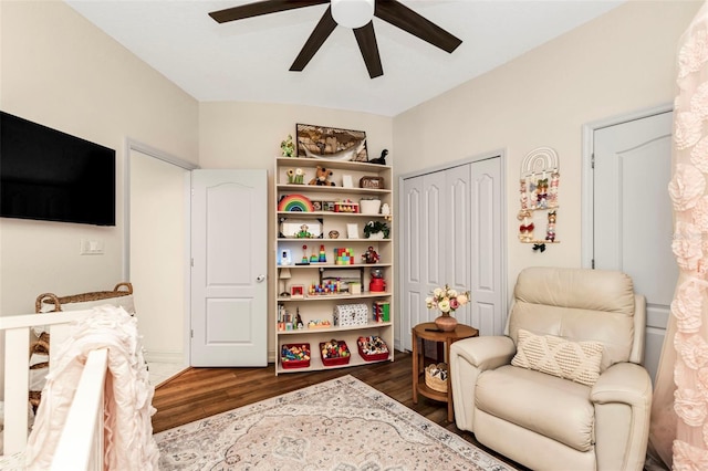 sitting room with dark hardwood / wood-style floors and ceiling fan