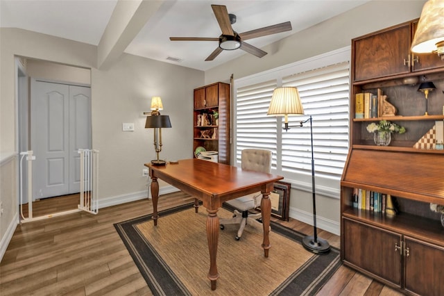 office featuring dark wood-type flooring and ceiling fan