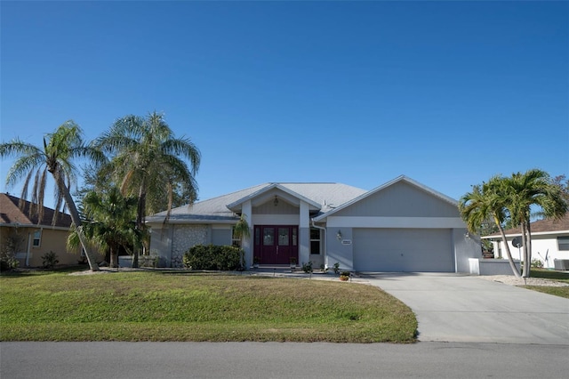 single story home with a garage and a front yard