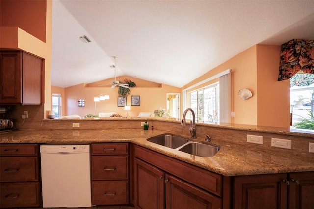 kitchen with sink, plenty of natural light, kitchen peninsula, and dishwasher