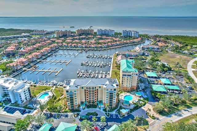 birds eye view of property with a water view