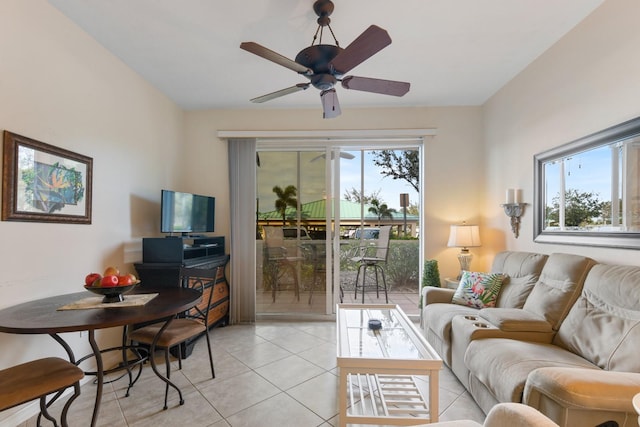 living room featuring ceiling fan and light tile patterned floors