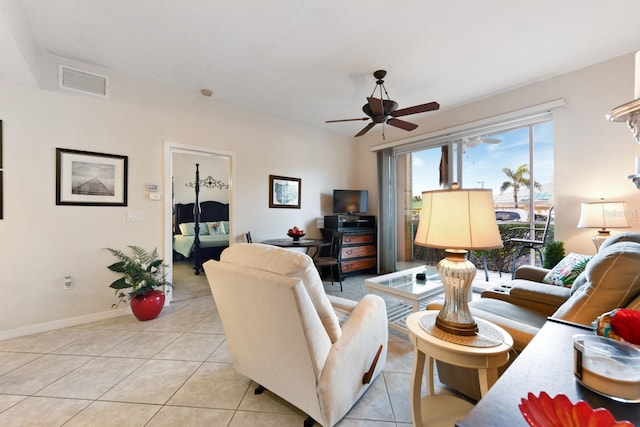 living room featuring light tile patterned floors and ceiling fan