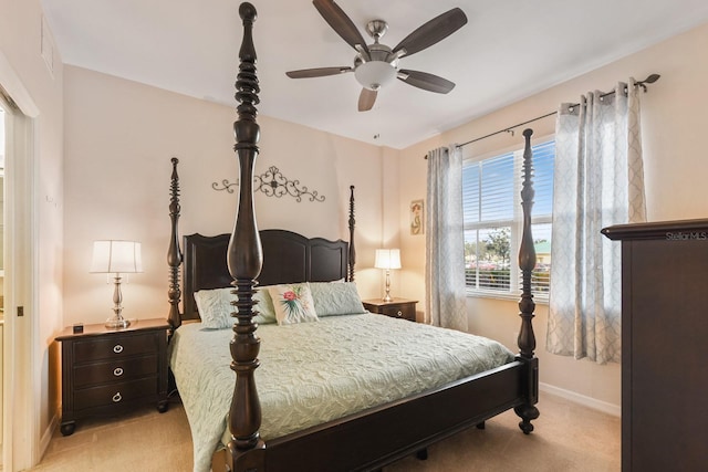 bedroom with ceiling fan and light carpet