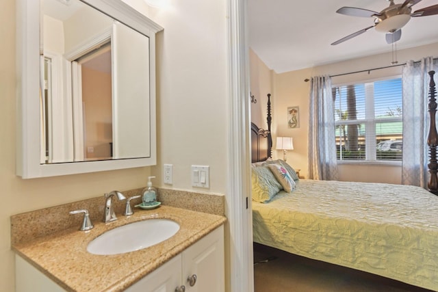 bedroom with ceiling fan, sink, and a closet