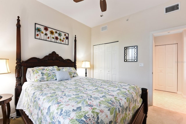 carpeted bedroom with ceiling fan and a closet