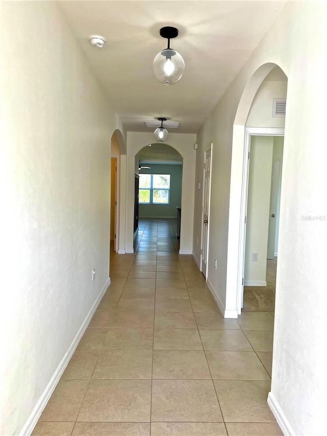 corridor featuring light tile patterned flooring