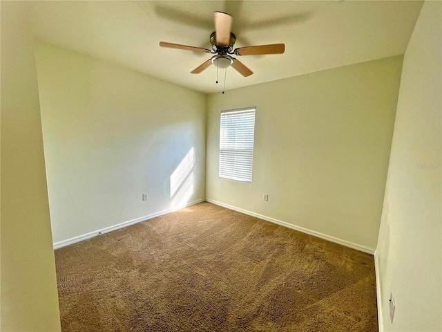 empty room featuring carpet floors and ceiling fan