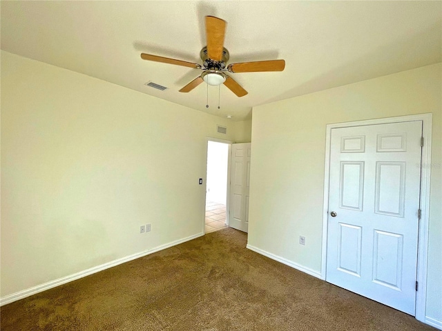 unfurnished bedroom featuring carpet flooring and ceiling fan