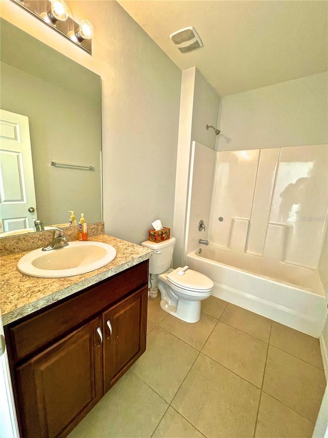 full bathroom with shower / bathing tub combination, vanity, tile patterned floors, and toilet