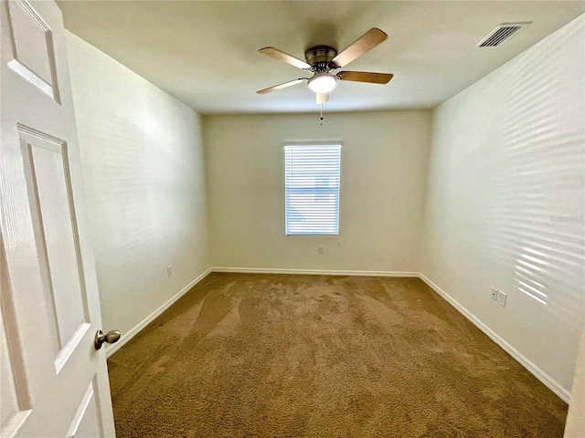 empty room with ceiling fan and carpet flooring