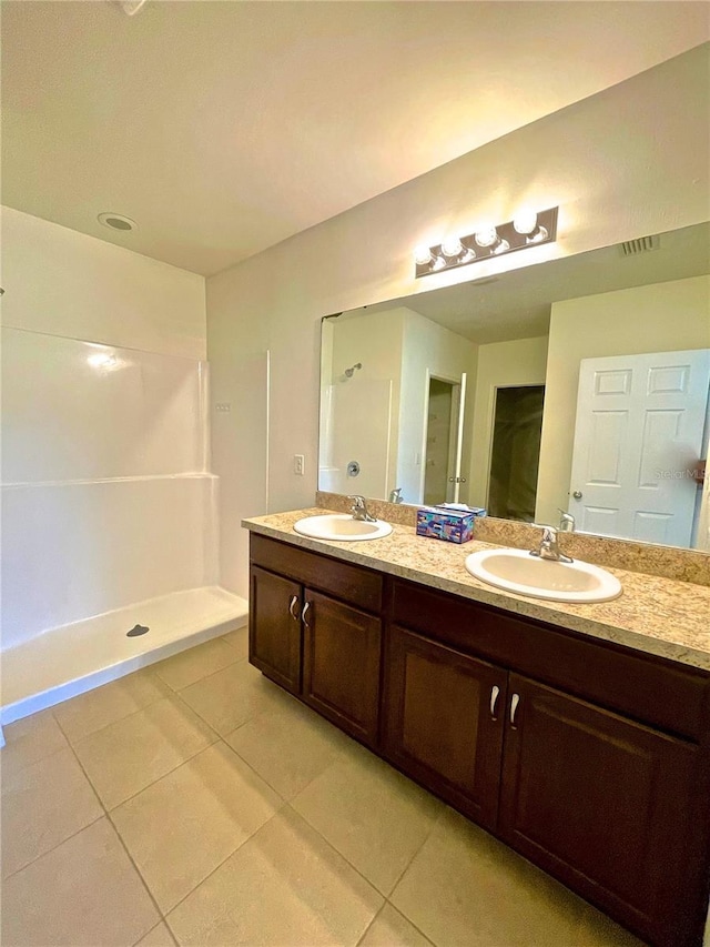 bathroom with vanity and tile patterned floors