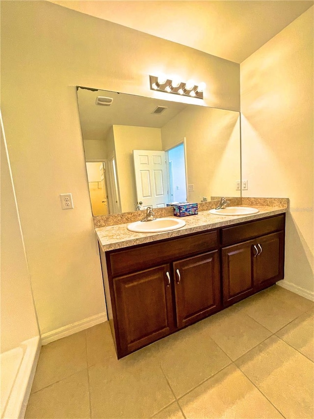 bathroom with vanity and tile patterned floors