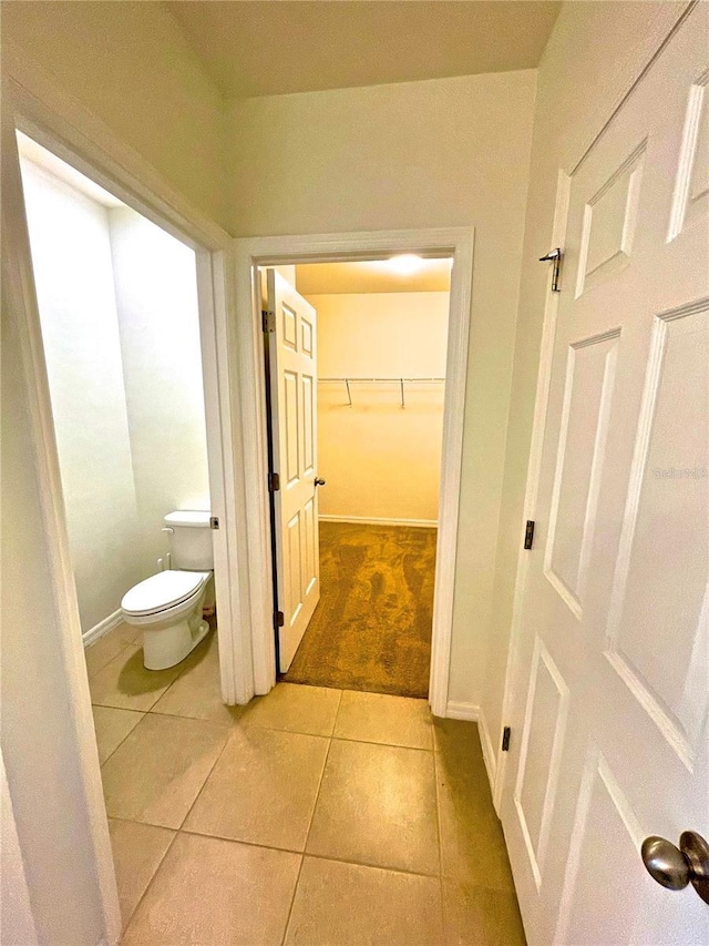 bathroom featuring tile patterned flooring and toilet