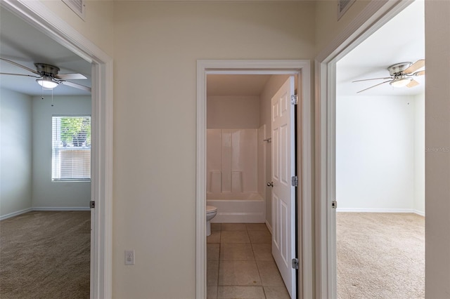 corridor with light colored carpet