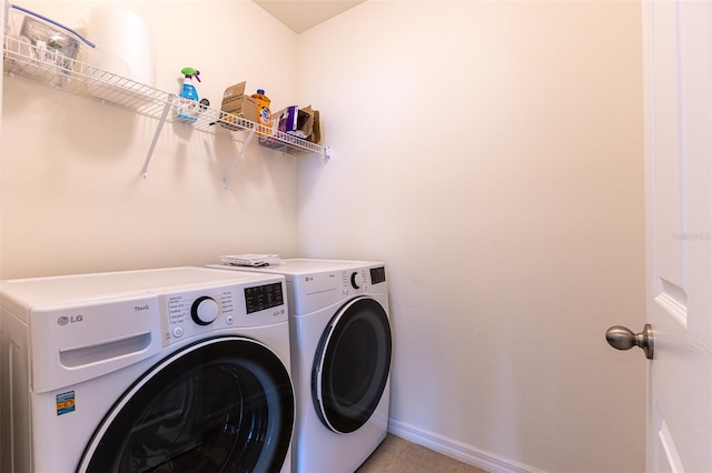 clothes washing area with washer and dryer