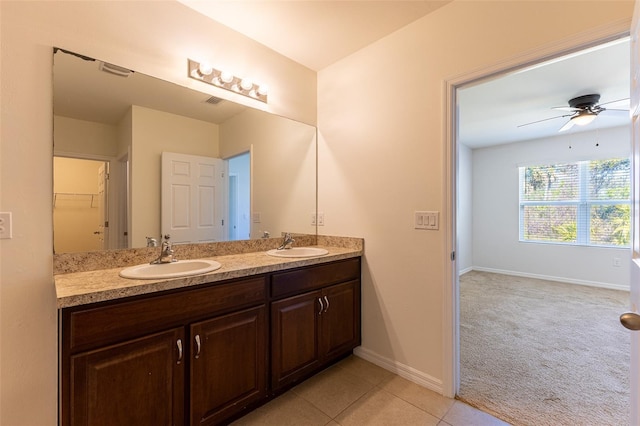 bathroom with ceiling fan, vanity, and tile patterned flooring