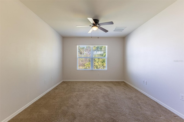 carpeted empty room with ceiling fan