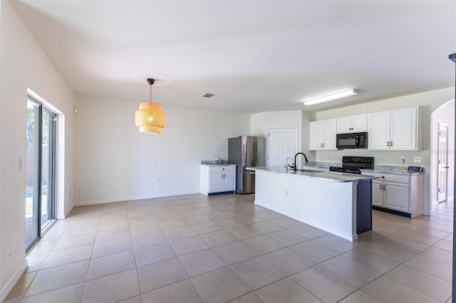 kitchen with sink, white cabinetry, black appliances, hanging light fixtures, and an island with sink