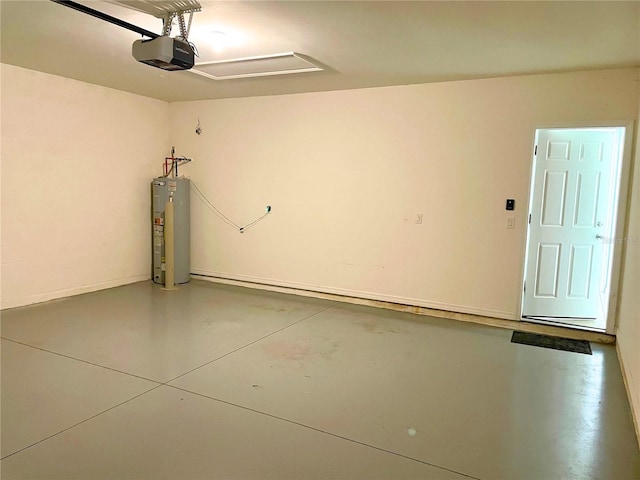 garage with a garage door opener and electric water heater