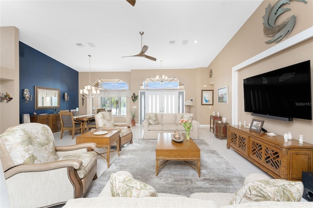 living room featuring lofted ceiling, light tile patterned floors, and a chandelier