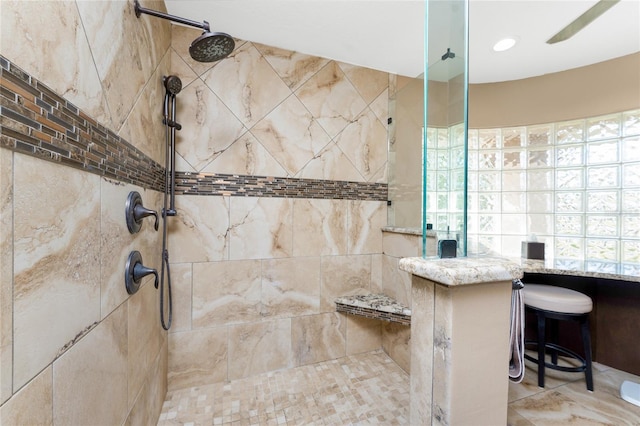 bathroom with a tile shower