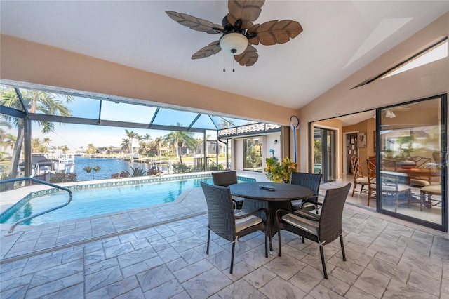 view of pool with a water view and ceiling fan