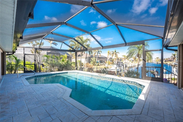 view of swimming pool with a lanai, a patio area, a boat dock, and a water view