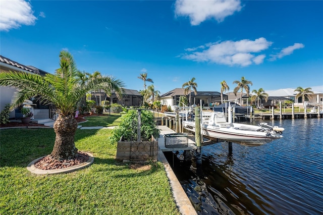 dock area with a water view and a lawn