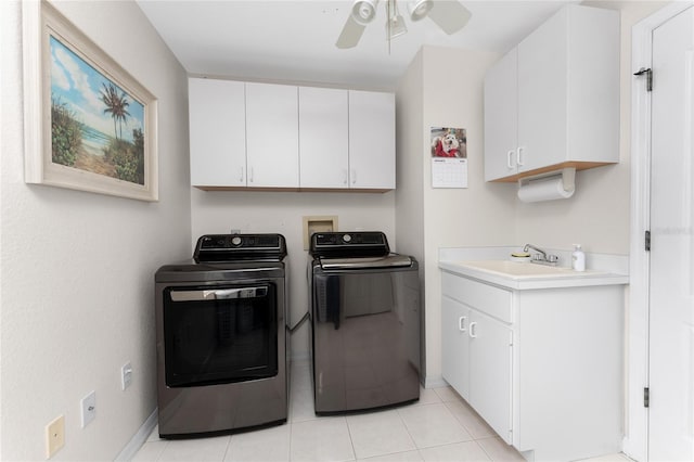 laundry area featuring separate washer and dryer, sink, cabinets, light tile patterned floors, and ceiling fan