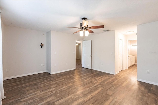 unfurnished room featuring ceiling fan and dark hardwood / wood-style flooring