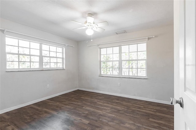 unfurnished room featuring dark hardwood / wood-style floors and ceiling fan