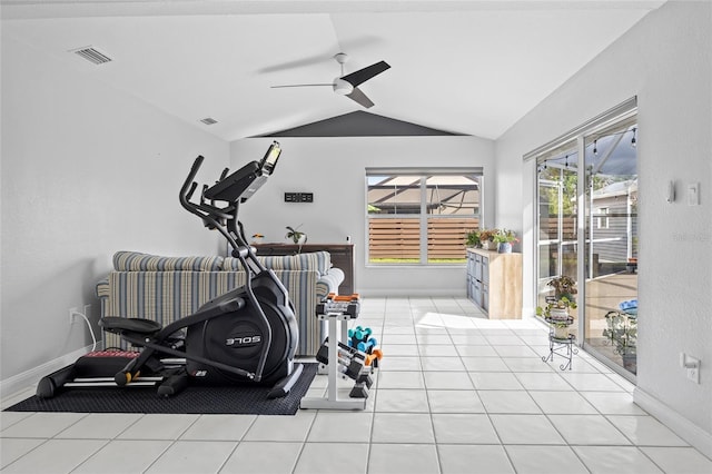 exercise area with ceiling fan, lofted ceiling, and light tile patterned floors