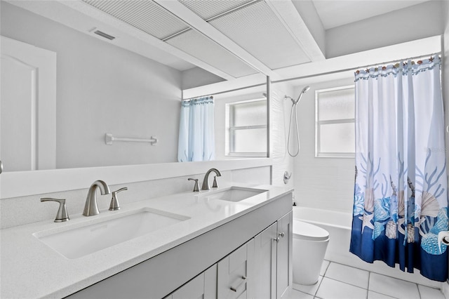 full bathroom with tile patterned flooring, vanity, shower / tub combo with curtain, and toilet