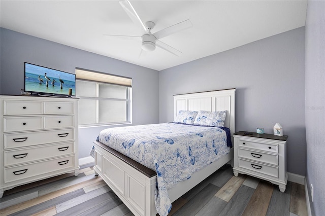 bedroom featuring wood-type flooring and ceiling fan