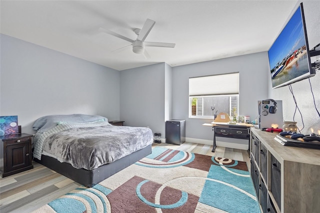 bedroom featuring ceiling fan and light hardwood / wood-style flooring