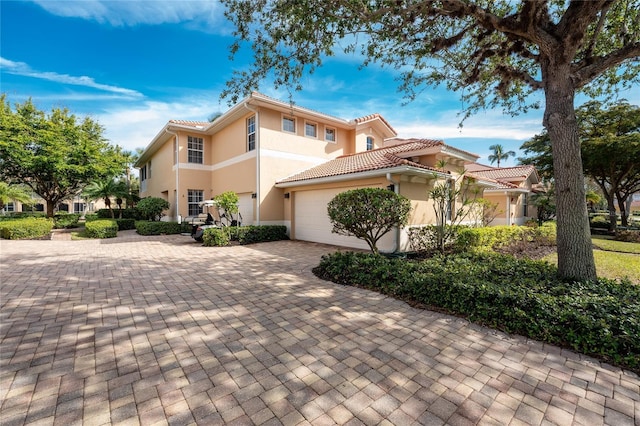 mediterranean / spanish-style house featuring a garage