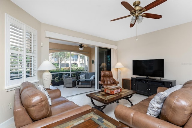 living room featuring light tile patterned floors and ceiling fan