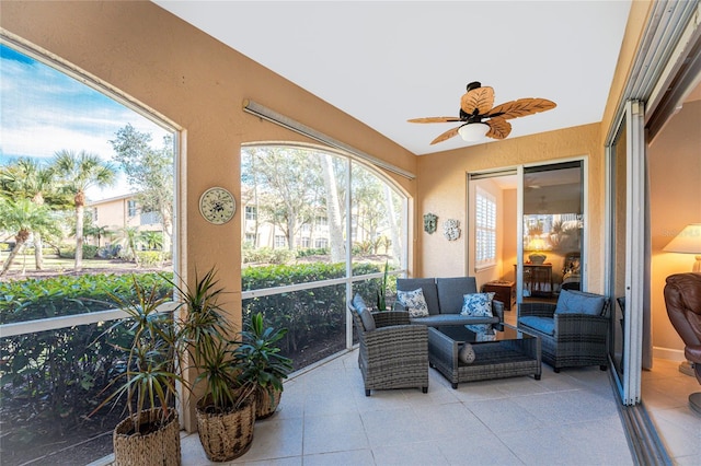 sunroom featuring ceiling fan