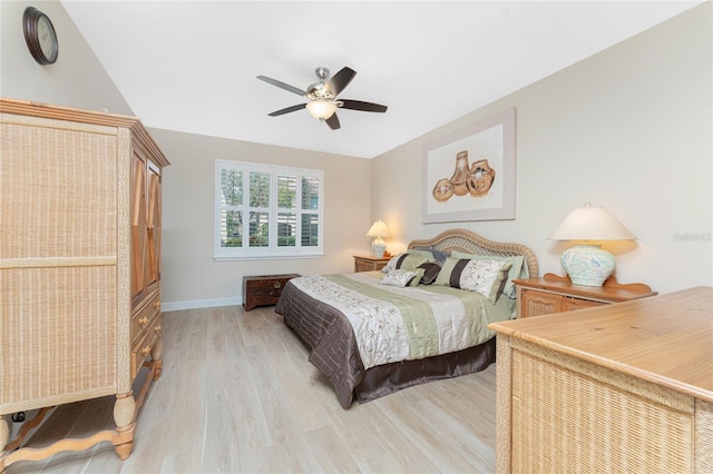 bedroom featuring ceiling fan and light hardwood / wood-style flooring