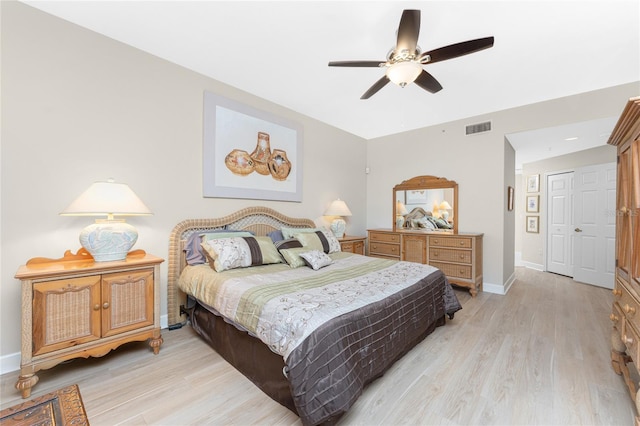 bedroom featuring ceiling fan and light hardwood / wood-style flooring