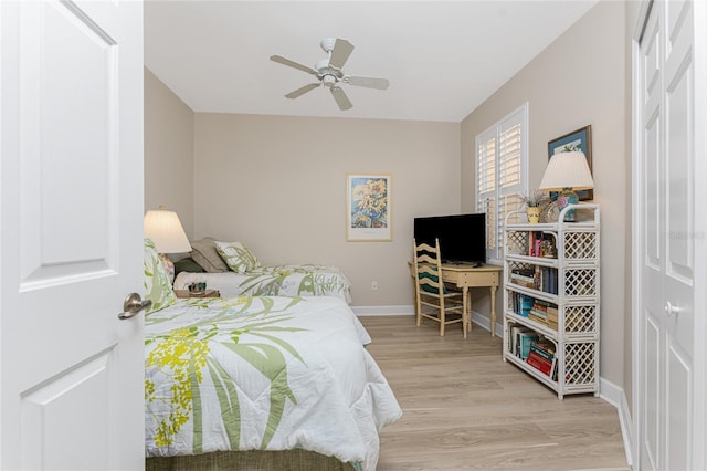 bedroom with ceiling fan and light wood-type flooring