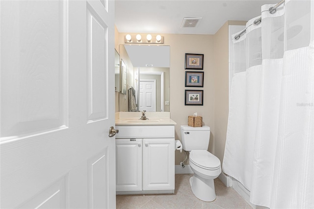 bathroom with vanity, toilet, curtained shower, and tile patterned flooring