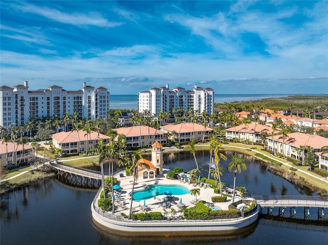 birds eye view of property with a water view