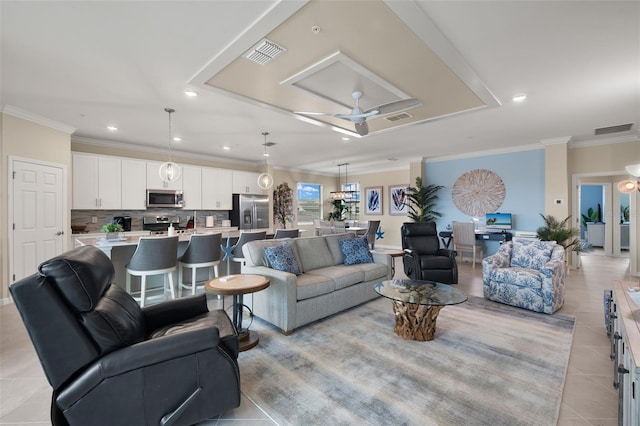 living room with light tile patterned floors, crown molding, and ceiling fan