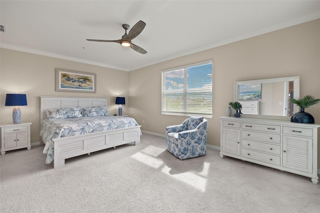 carpeted bedroom featuring crown molding and ceiling fan