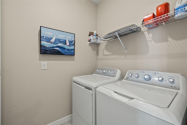 washroom featuring independent washer and dryer